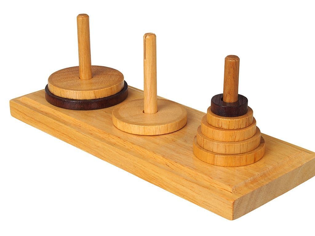 Hoe heet de puzzel waarbij het de bedoeling is van dezelfde toren te bouwen op de derde staaf, waarbij je maar 1 schijf per keer mag verplaatsen en nooit een grotere op een kleinere schijf mag leggen?